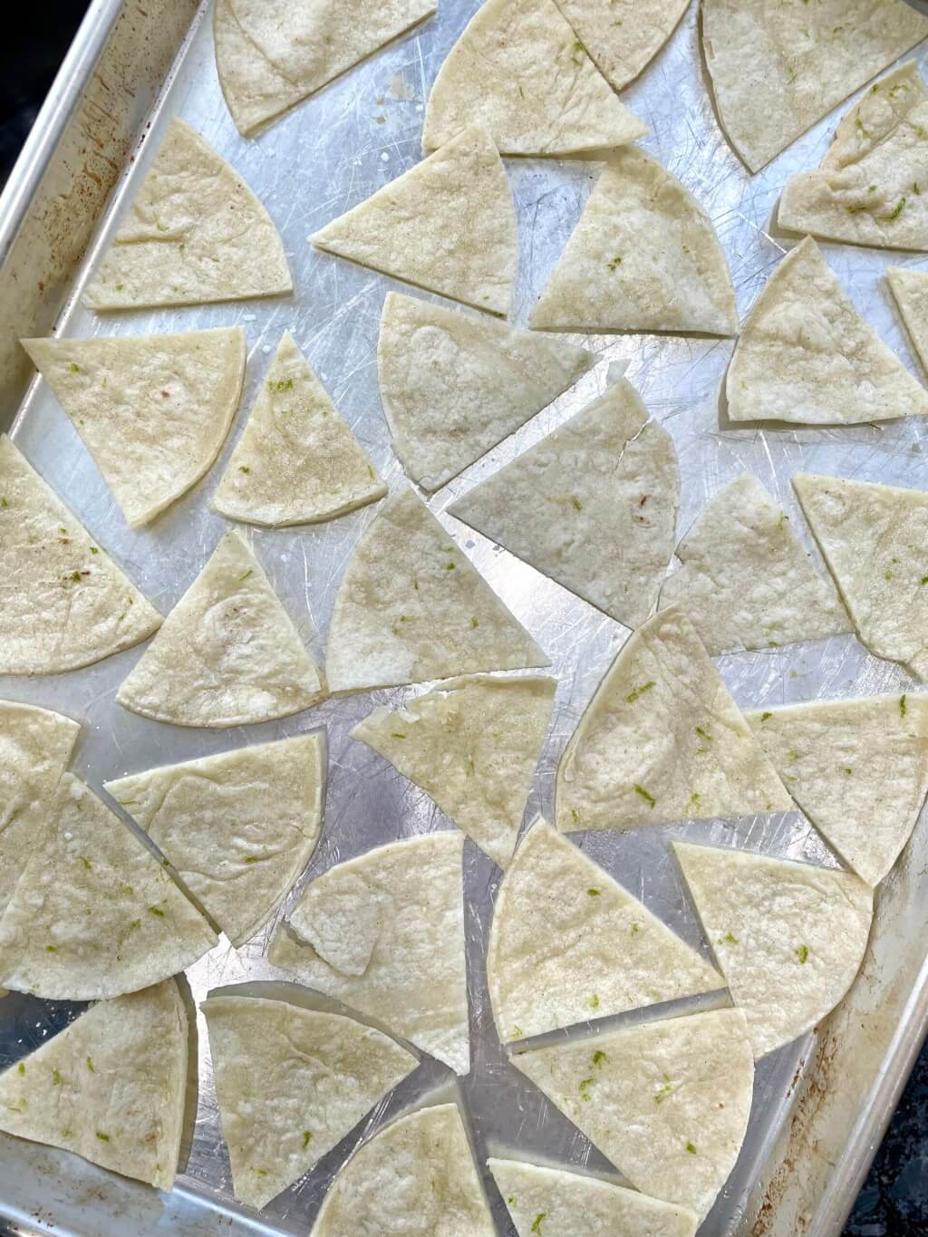 The salted, lime-infused crunch of a favorite store-bought tortilla chip is easy to recreate at home with a short list of ingredients and in minimal time.