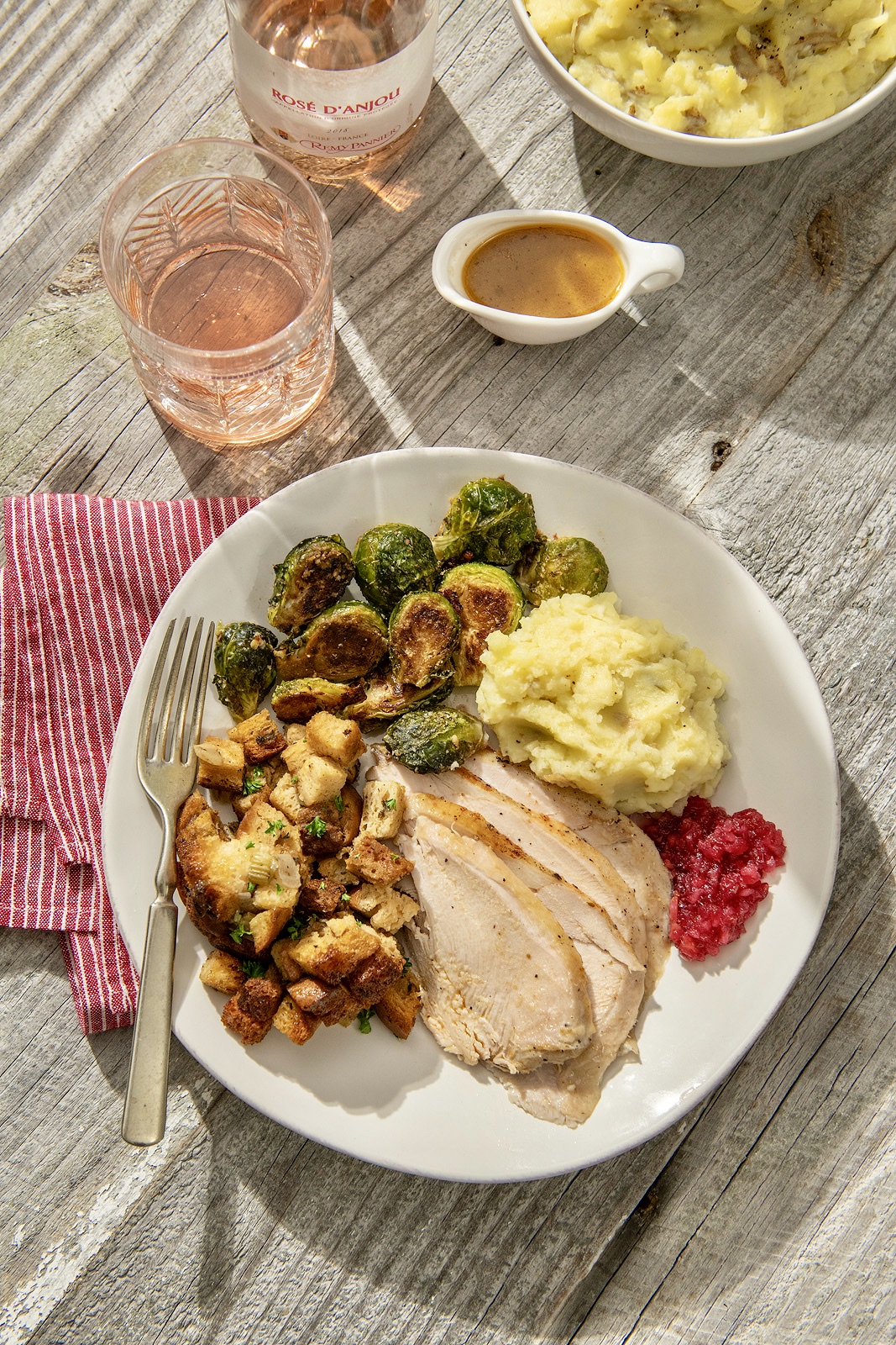 This hands-off, foolproof way to achieve tender, juicy white meat can be prepped the night ahead if desired and the gravy is spectacular.