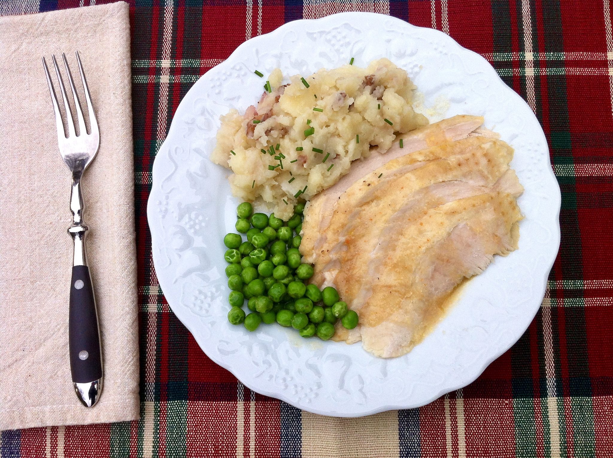 This hands-off, foolproof way to achieve tender, juicy white meat can be prepped the night ahead if desired and the gravy is spectacular.