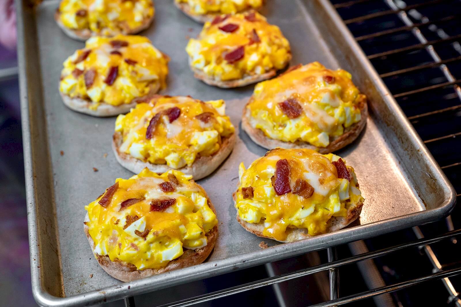 Not your usual egg sandwich, the flavor-packed topping can be prepared in advance and then baked on the bread when ready to eat. Crunchy, creamy, and utterly delicious!