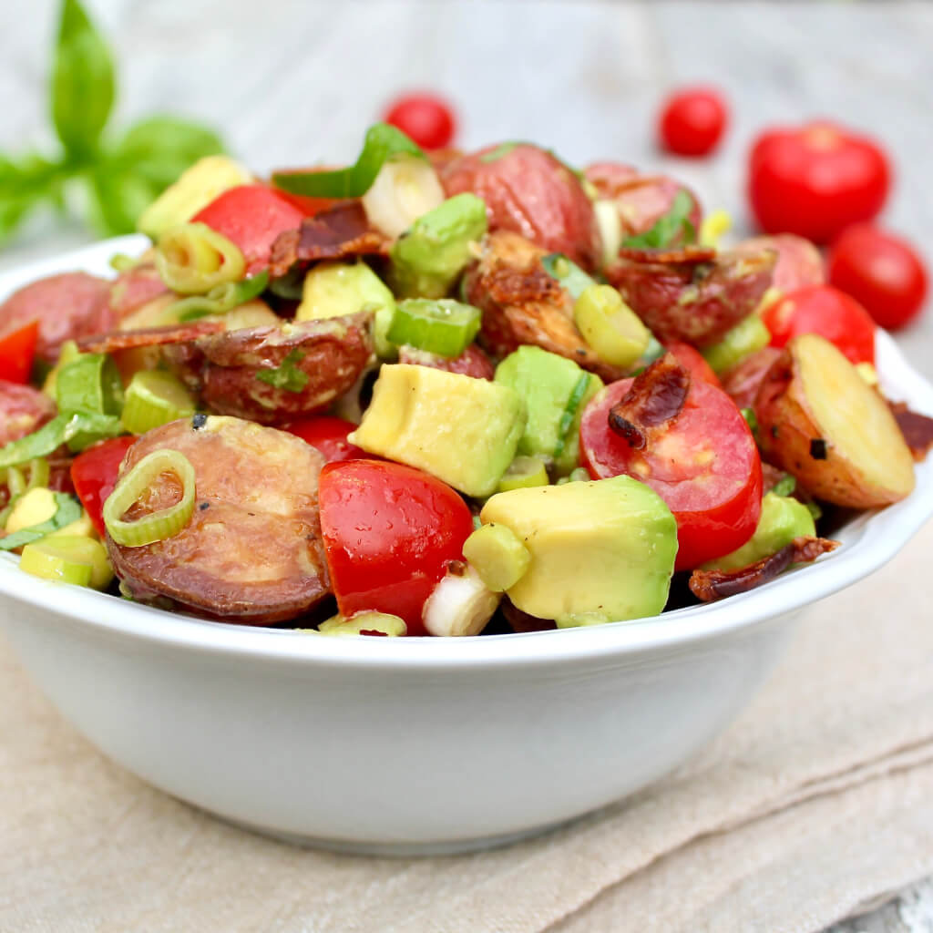 Buttery avocado, juicy tomatoes, and a bit of crisp bacon will shake up your potato salad routine for a light yet filling spin on the classic dish.