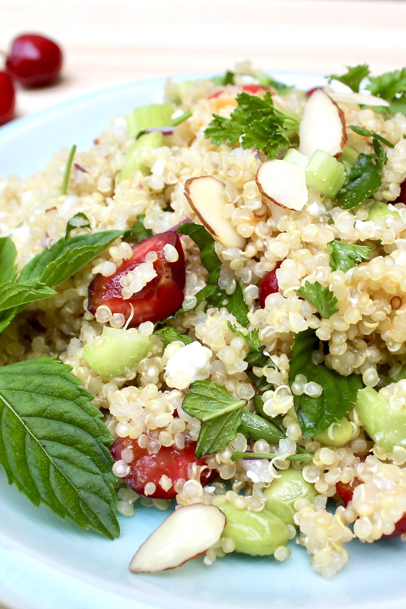 Sweet Cherry & Feta Quinoa with Peach Vinaigrette-a light, flavor-packed salad that's delightful paired with virtually any grilled protein but stands alone as a complete vegetarian meal