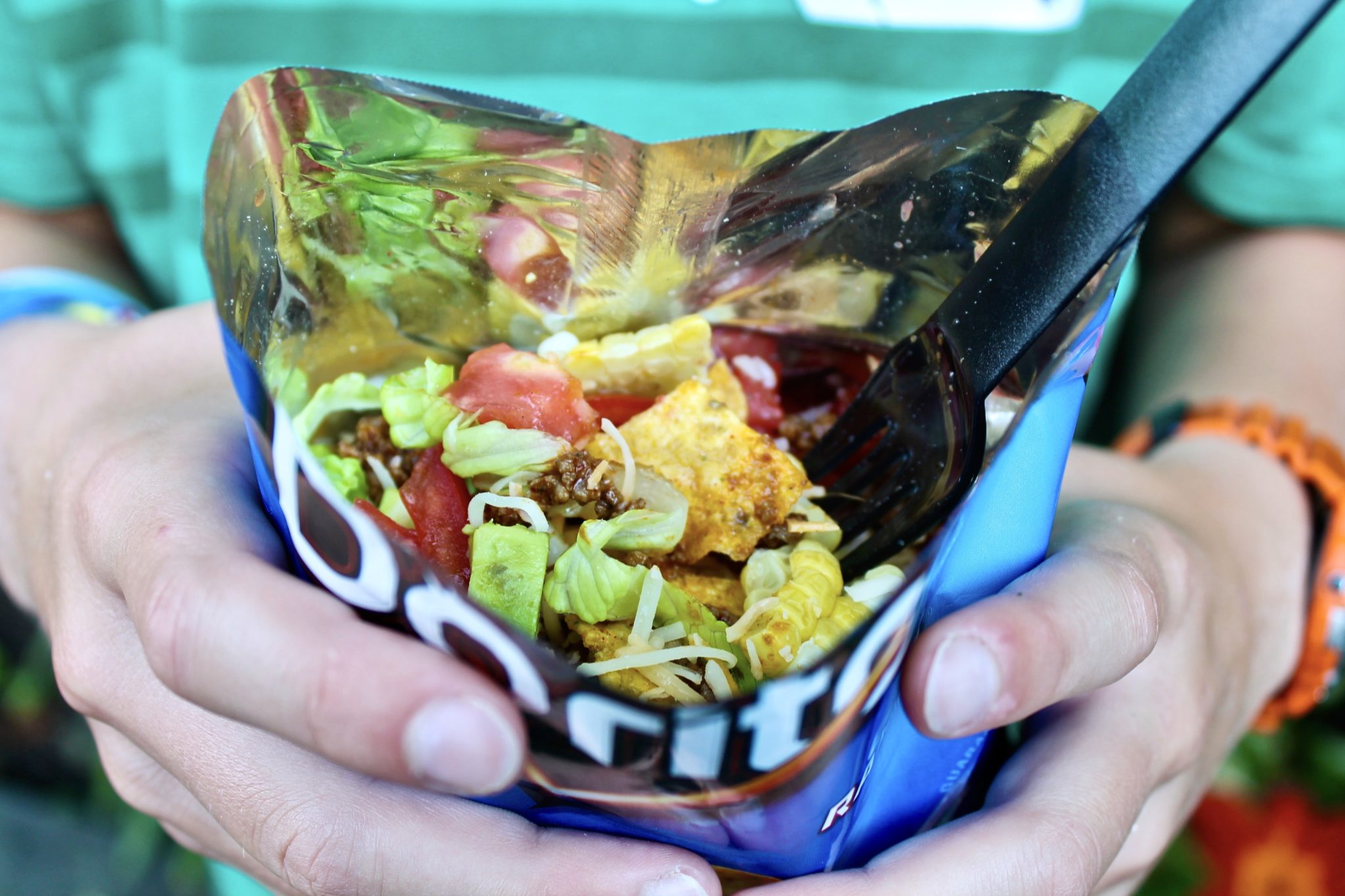 Walking Tacos offer a fun, portable way to enjoy the traditional taco salad and are perfect for kids' parties and casual dinners. Those who prefer a plated version may absolutely eat the meal that way.