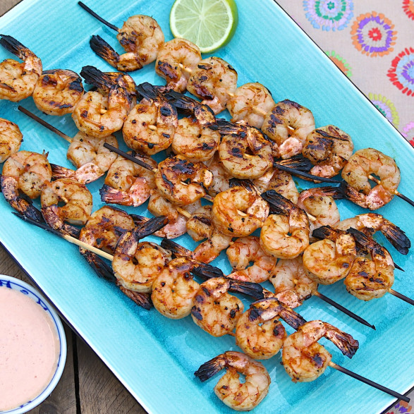 For a crowd-pleasing appetizer option, remove the cooked shrimp from the skewers to a platter. Optionally, thread one or two shrimp onto shorter skewers and leave on the skewers for guests to pick up and enjoy. The shrimp may be served hot or at room temperature.