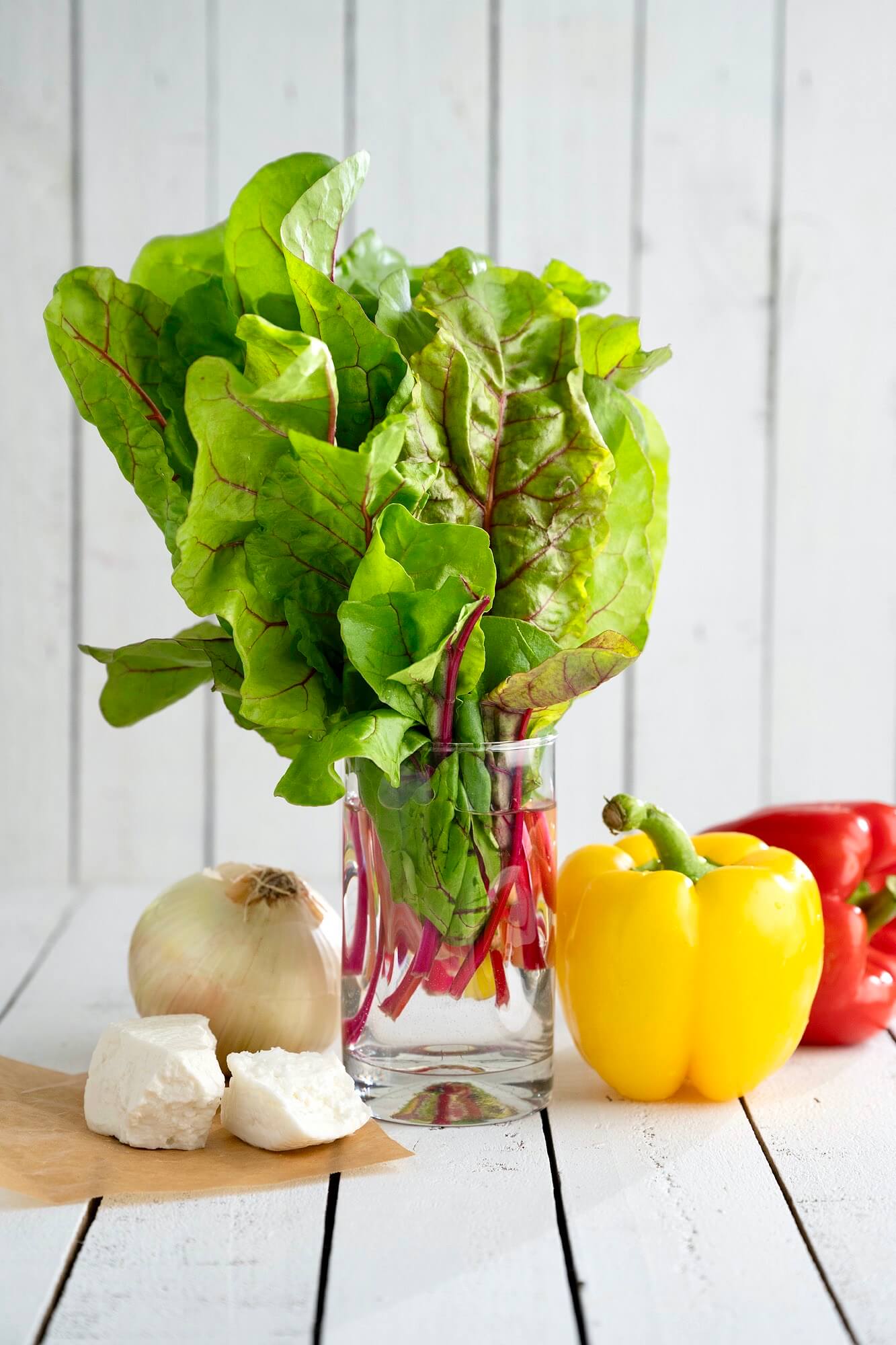 Crave-worthy greens are easy thanks to this unique method of preparation that delivers crisps edges and golden brown bits of feta...all while adding a few other colorful veggies to the mix