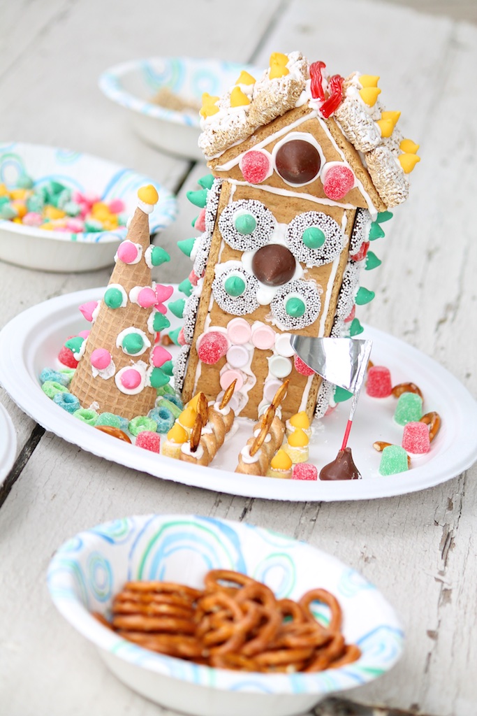 No-bake graham cracker houses are easier than their gingerbread counterparts but every bit as festive. The fun activity is sure to bring good cheer and enhance your holiday decor!