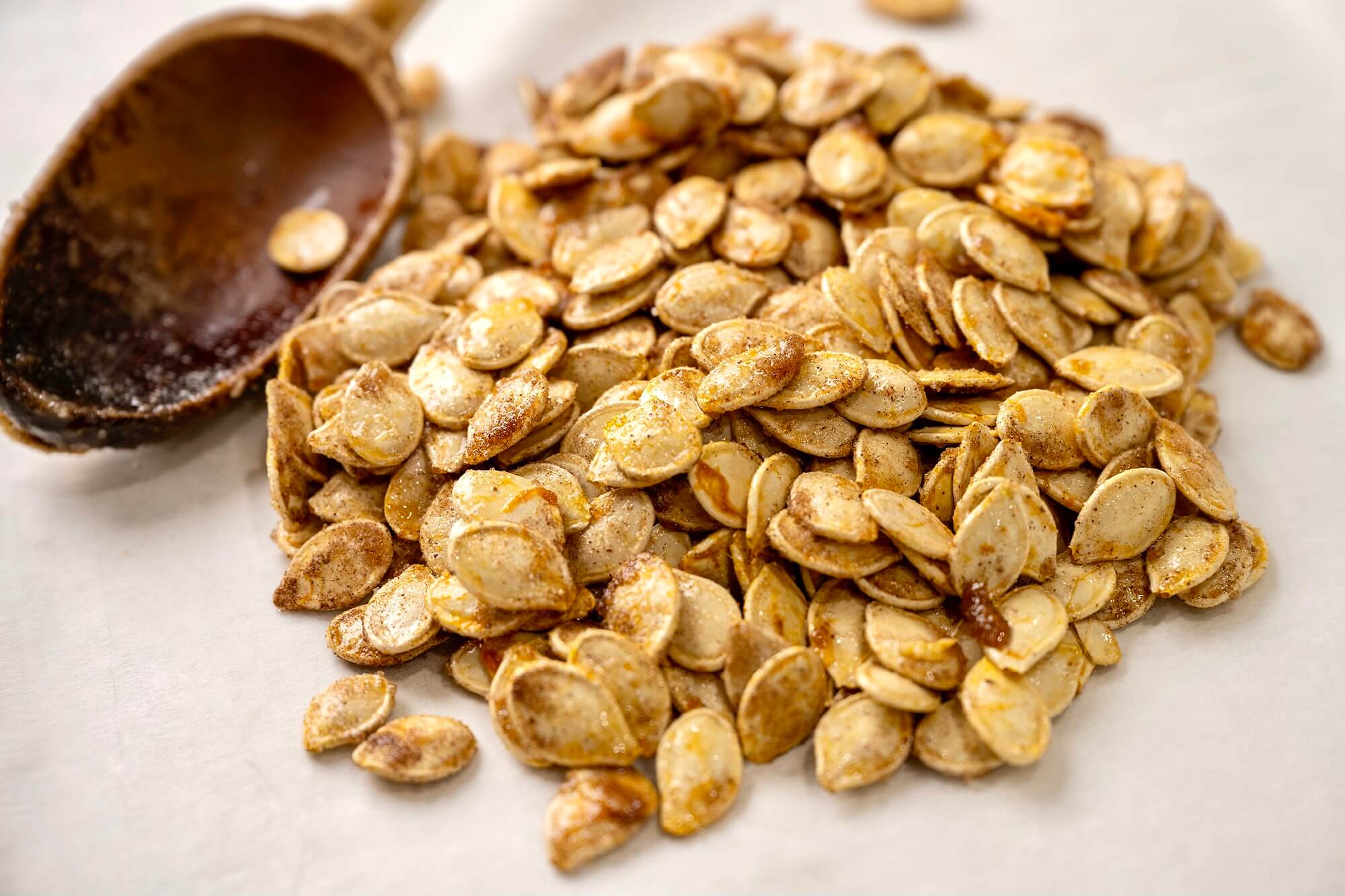 Sugar and spice and everything nice, these crispy seeds offer a snack-worthy way to make the most of your annual pumpkin carving ritual. Taking the time to dry out the seeds, as described in the recipe notes, will create the crispiest, most flavorful seeds.