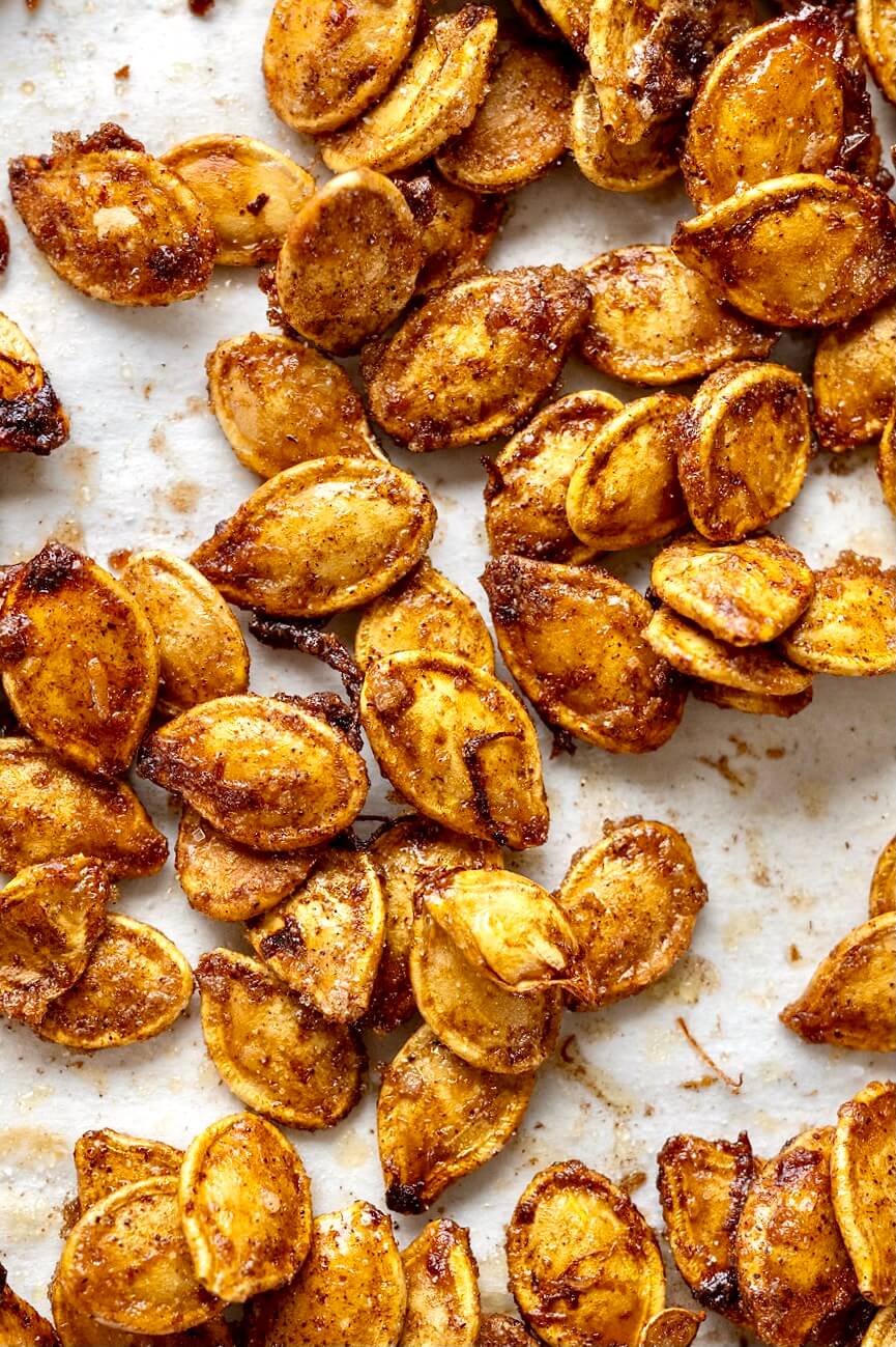 Sugar and spice and everything nice, these crispy seeds offer a snack-worthy way to make the most of your annual pumpkin carving ritual. Taking the time to dry out the seeds, as described in the recipe notes, will create the crispiest, most flavorful seeds.