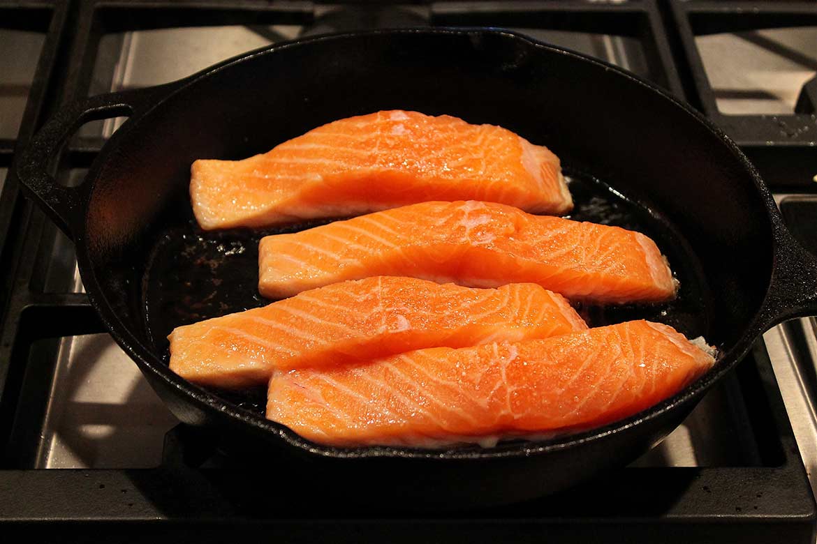 Crispy Skin Salmon -- A quick sear on the stovetop creates tender salmon with deliciously crispy skin... perfect with your favorite seasonal side dishes or as a salad topper!