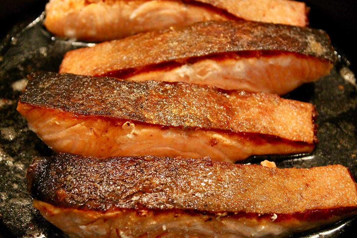 Crispy Skin Salmon -- A quick sear on the stovetop creates tender salmon with deliciously crispy skin... perfect with your favorite seasonal side dishes or as a salad topper!