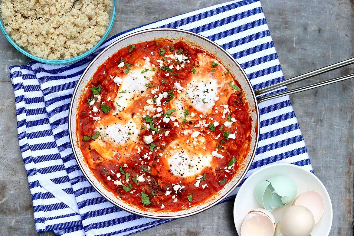 Shakshuka with Grains and Greens -- In this twist on the traditional dish, hearty whole grains and healthy greens are added to the saucy eggs for an all-in-one weeknight meal that tastes great leftover, too.