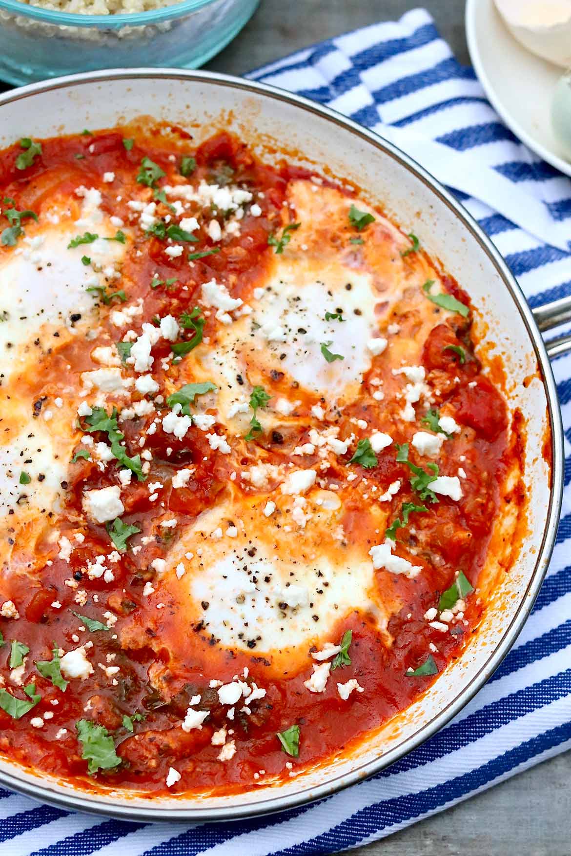 Shakshuka with Grains and Greens -- In this twist on the traditional dish, hearty whole grains and healthy greens are added to the saucy eggs for an all-in-one weeknight meal that tastes great leftover, too.