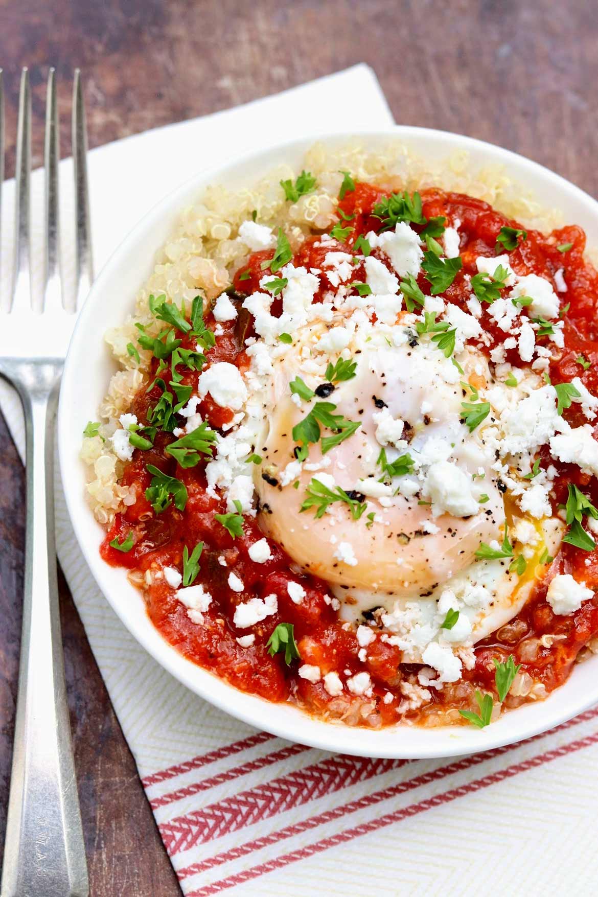 Shakshuka with Grains and Greens -- In this twist on the traditional dish, hearty whole grains and healthy greens are added to the saucy eggs for an all-in-one weeknight meal that tastes great leftover, too.