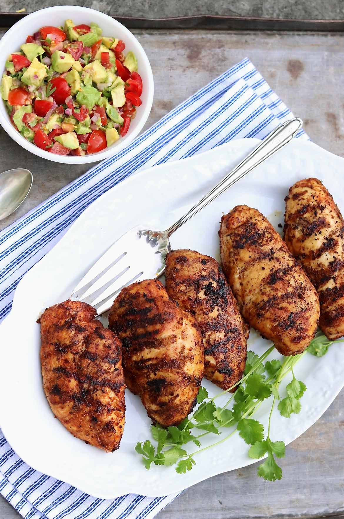 Sazón Grilled Chicken - This little spice packet (or the easy homemade option) adds incredible flavor when used as a rub for grilled chicken!