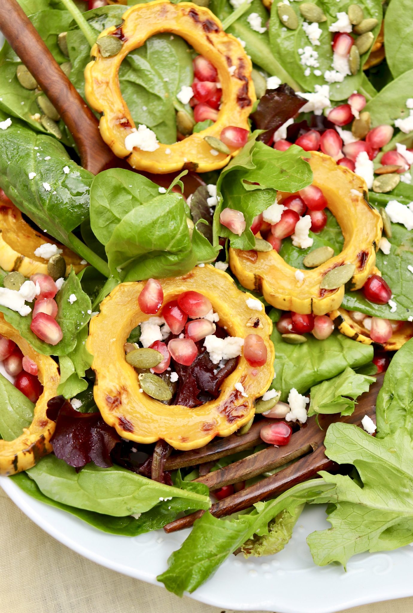 Radiant jewel tones make this versatile salad stunning AND healthy. Feel free to substitute any winter squash (even sweet potatoes) or use cranberries in place of pomegranate!