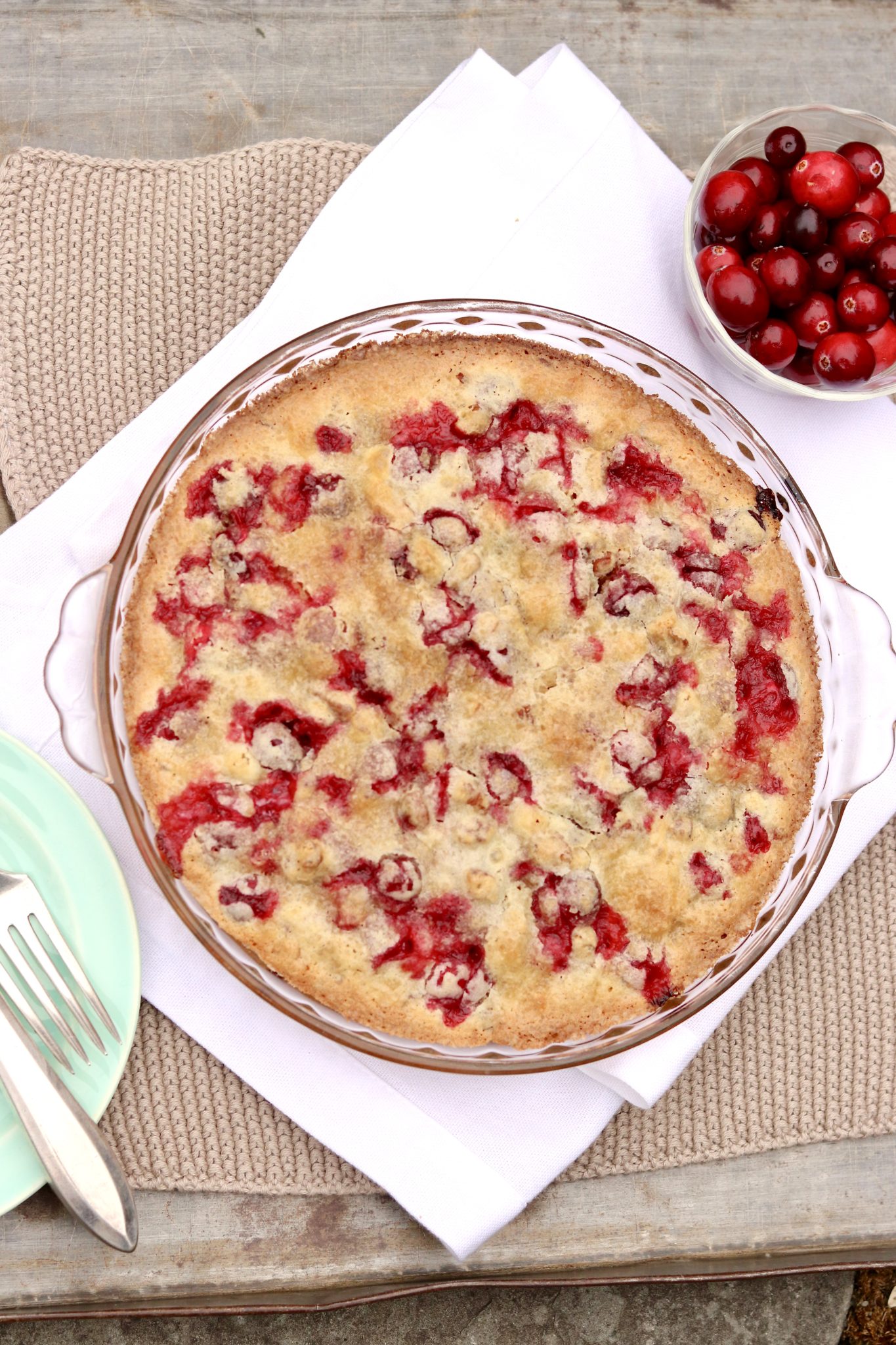 Crustless Cranberry Pie-festive, seasonal and so easy to make with pantry staples, this sweet-tart treat is fruit forward like a pie but somewhat cakier in texture.