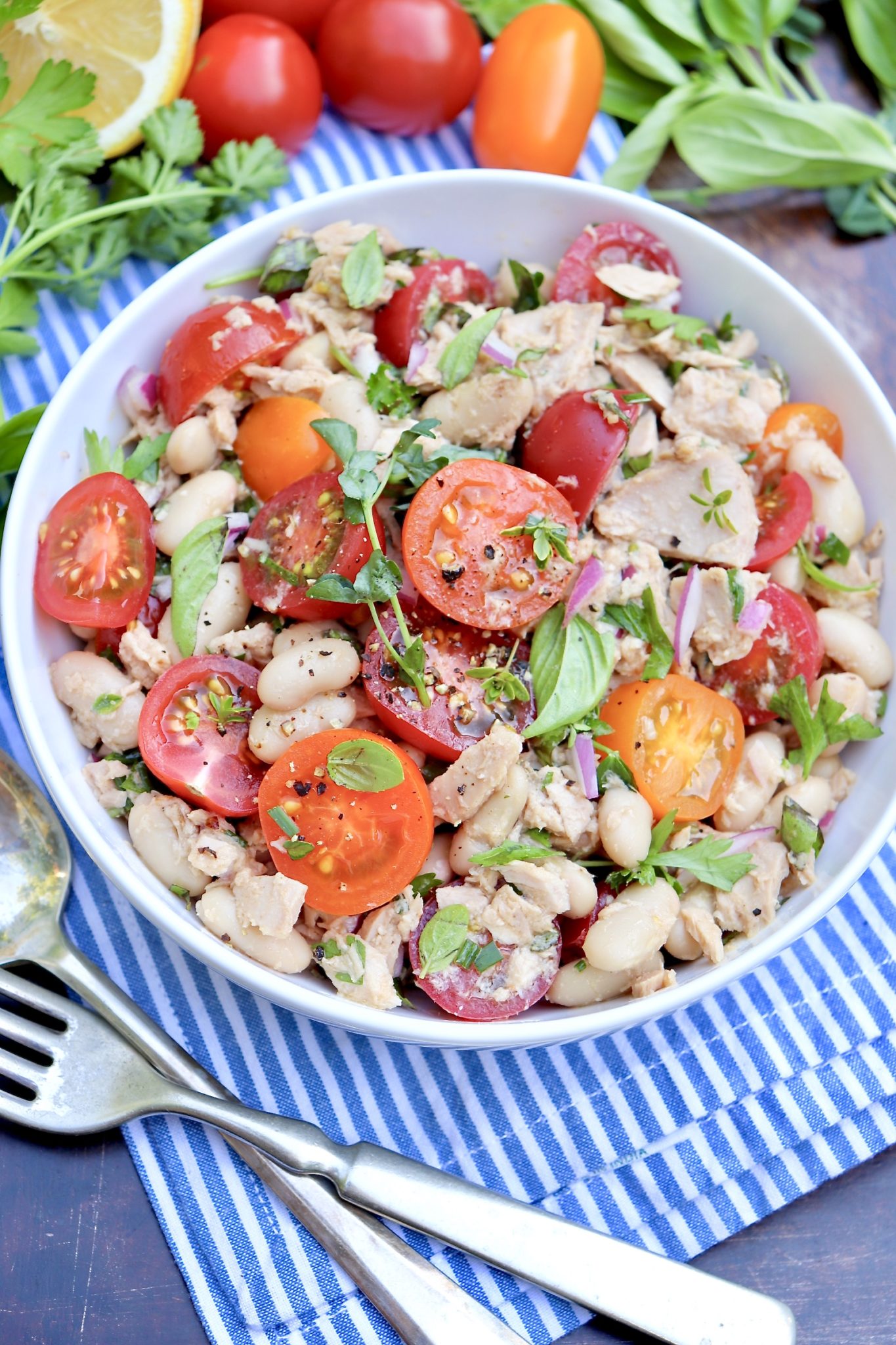Tuna, Tomato & White Bean Salad-Pantry staples meet sweet tomatoes and a handful of fresh herbs in this protein-rich, flavor-packed salad. Enjoy it as an easy lunch or pair with an ear of corn, piece of cornbread or a crusty roll for a light but filling dinner. (Leftovers taste great, too!)