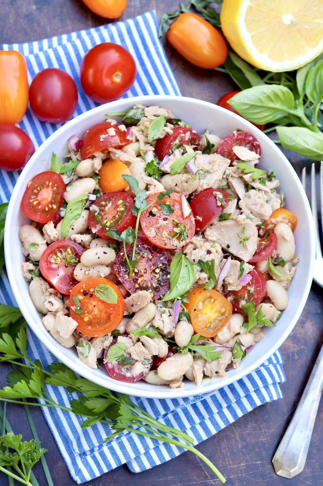 Tuna, Tomato & White Bean Salad-Pantry staples meet sweet tomatoes and a handful of fresh herbs in this protein-rich, flavor-packed salad. Enjoy it as an easy lunch or pair with an ear of corn, piece of cornbread or a crusty roll for a light but filling dinner. (Leftovers taste great, too!)