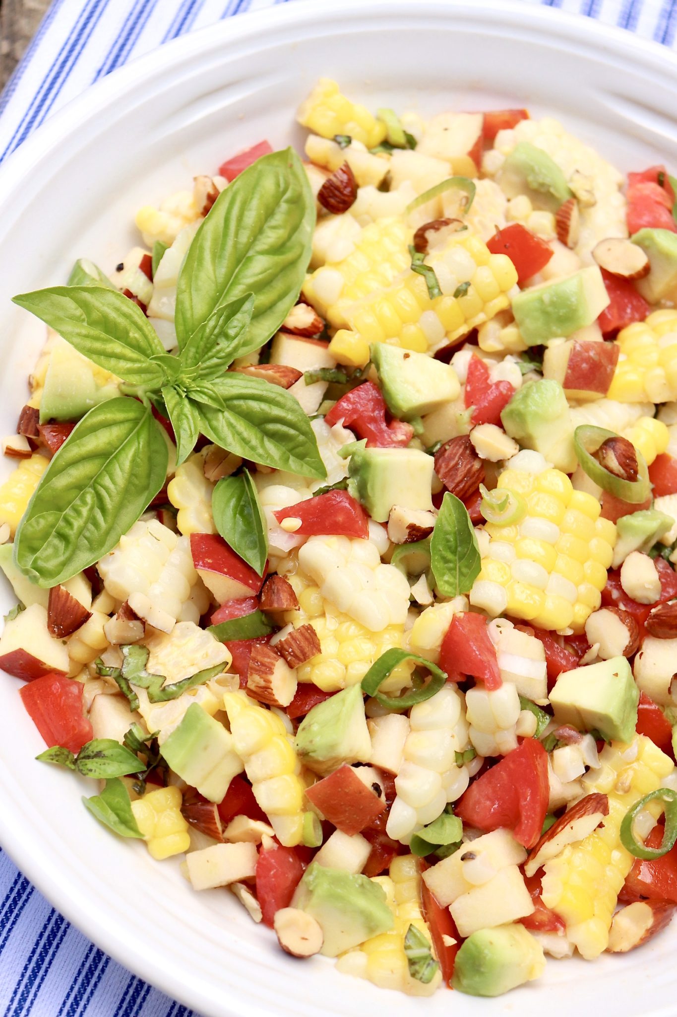 NAPA SWEET CORN SALAD-An unexpected ingredient adds crisp crunch to a classic corn salad, and the easy vinaigrette pulls it all together. Perfect for summer and fall meals!