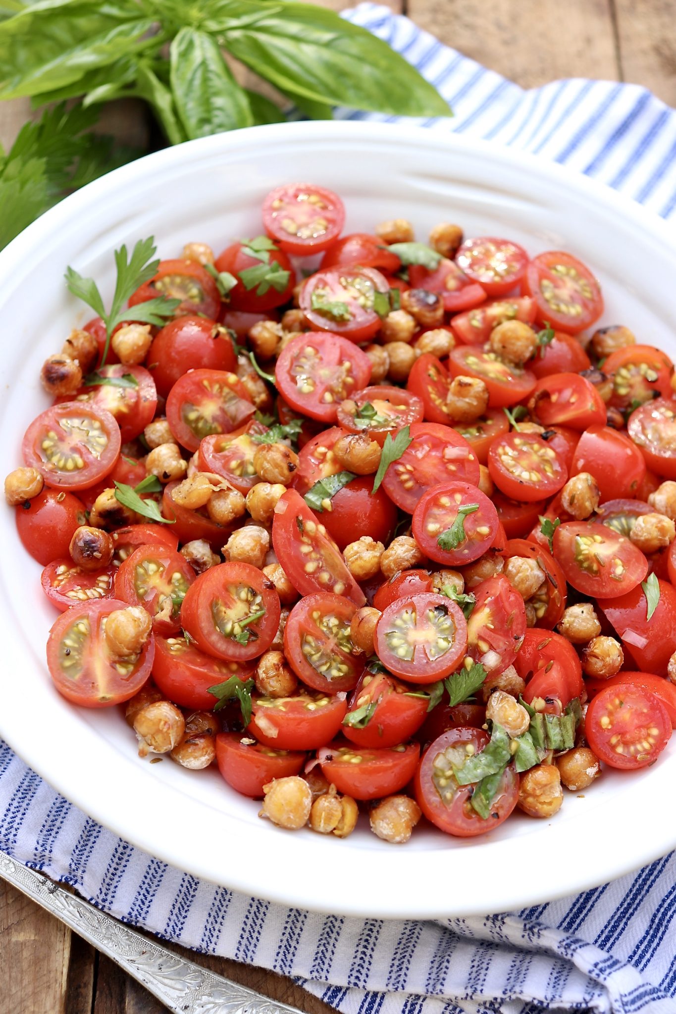 TOMATO & SEARED GARBANZO SALAD-Garden fresh tomatoes meet the humble can of beans in this healthy, protein-rich salad. A few additional pantry items supply unparalleled flavor.