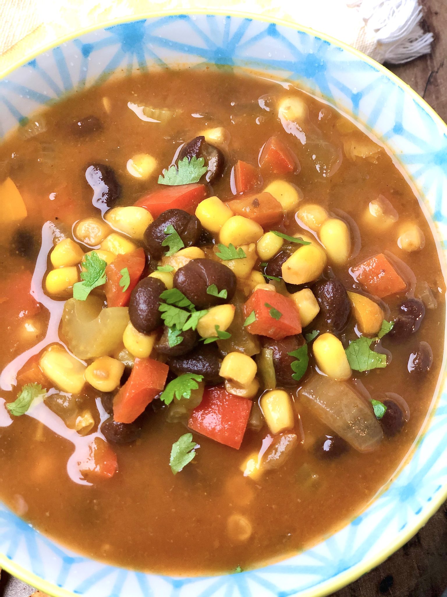 PUMPKIN AND BLACK BEAN SOUP - a super-healthy, stick-to-your-ribs, vegan soup that's easy to customize. The big-batch recipe only gets better with age, making leftovers a real treat!