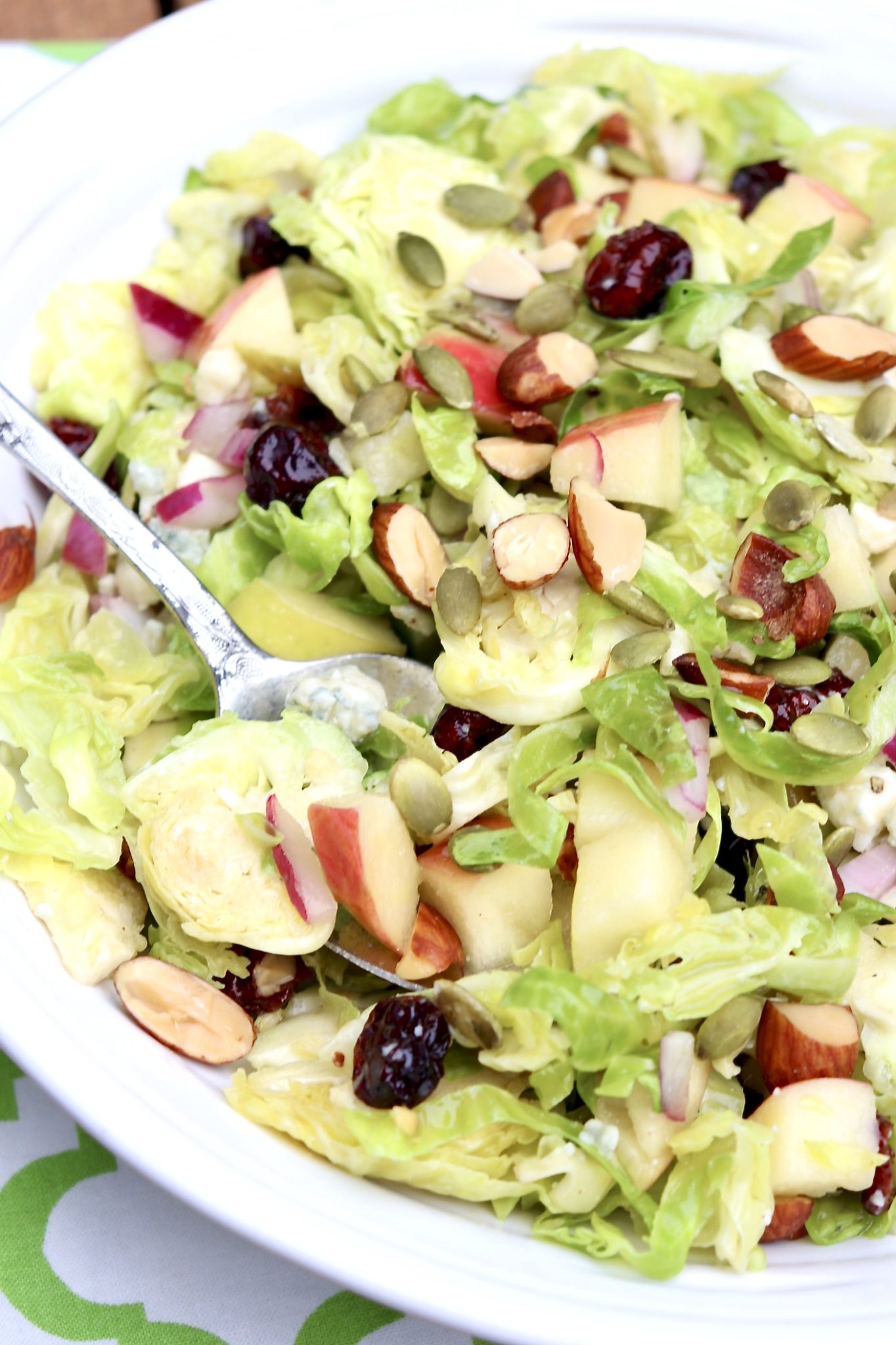 FAVORITE BRUSSELS SPROUTS SALAD - A go-to salad for busy nights, parties, potlucks and 100% worthy of a holiday table. This super-satisfying salad can be made in advance and you'll want to use the dressing over and over again.