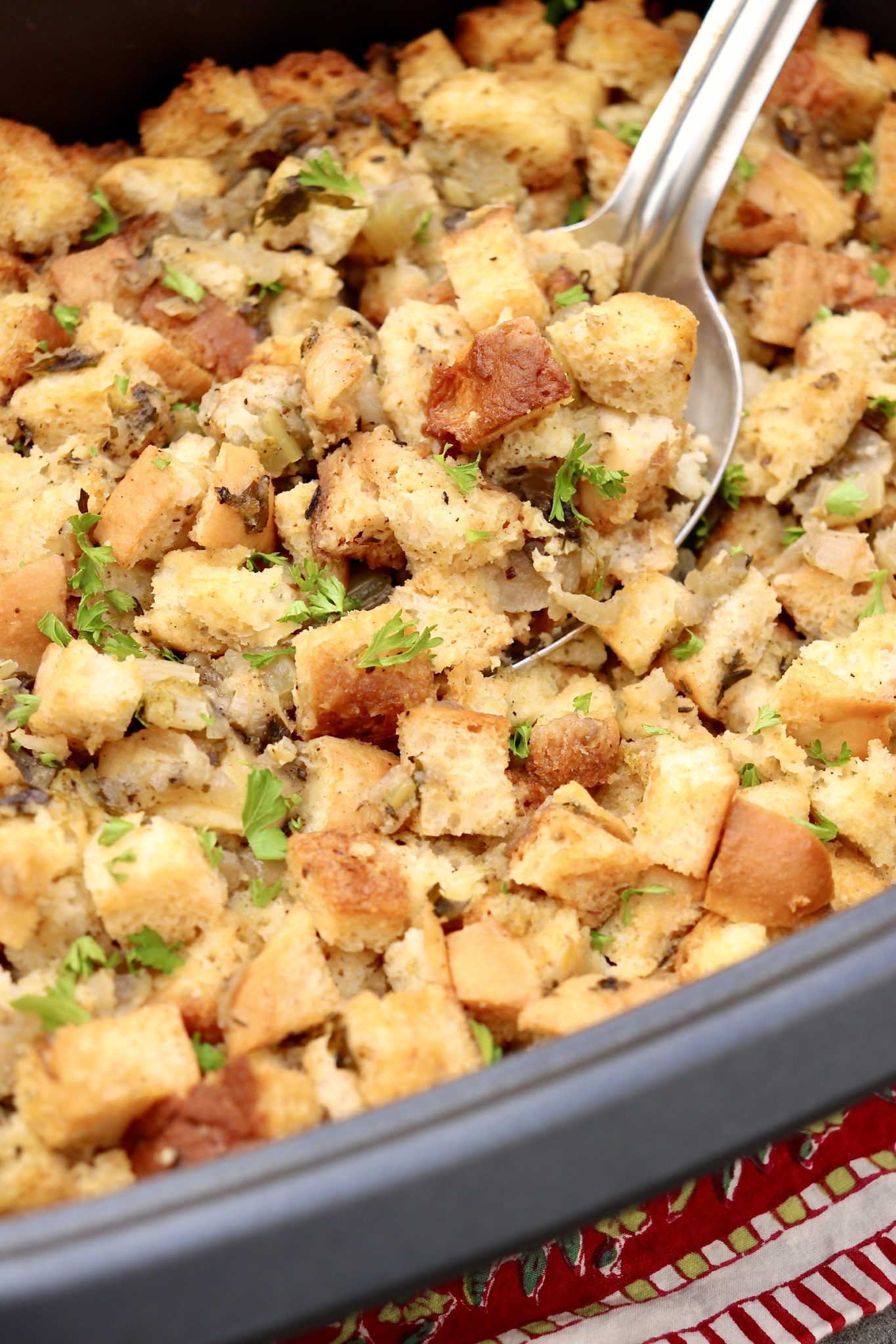SLOW COOKER STUFFING (with oven method) -Tender stuffing with crispy edges is 100% possible in a slow cooker, freeing up precious oven space. Classic flavor will win you over, optional add-ins and prep-ahead tips will keep everyone happy!