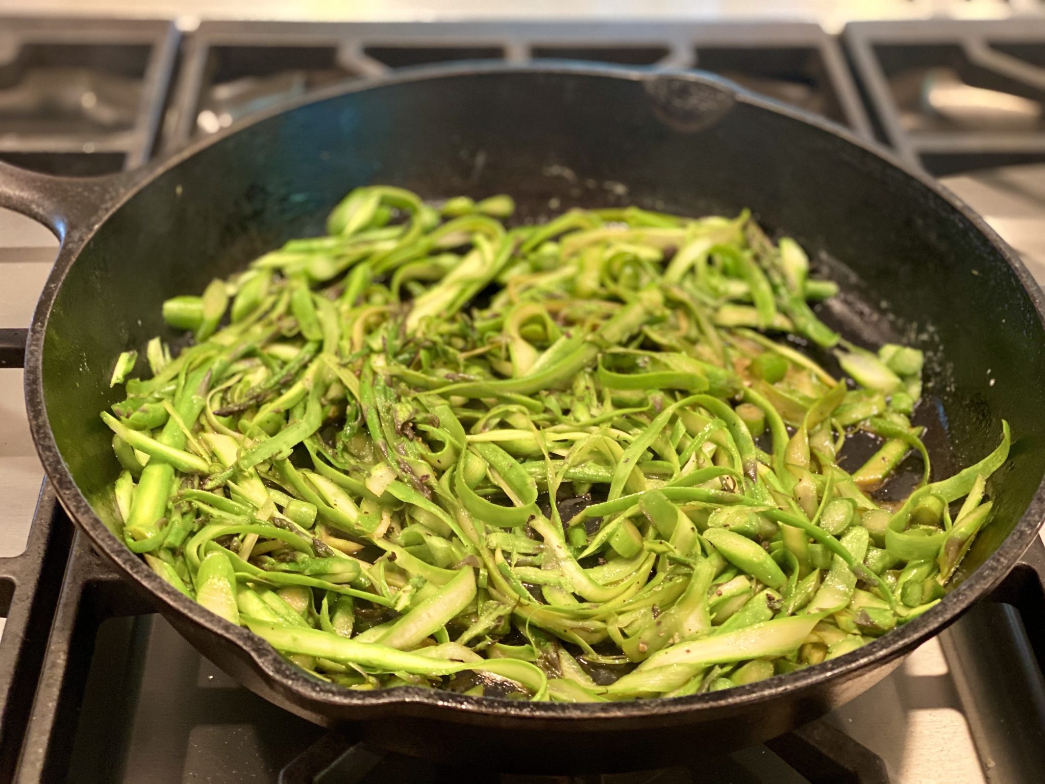 A clever method of cutting asparagus and a super simple sauce creates a memorable dish that, when served over rice, stands somewhere between comfort food and culinary bliss. The addition of shrimp, chicken or your favorite protein turns it into a complete meal!