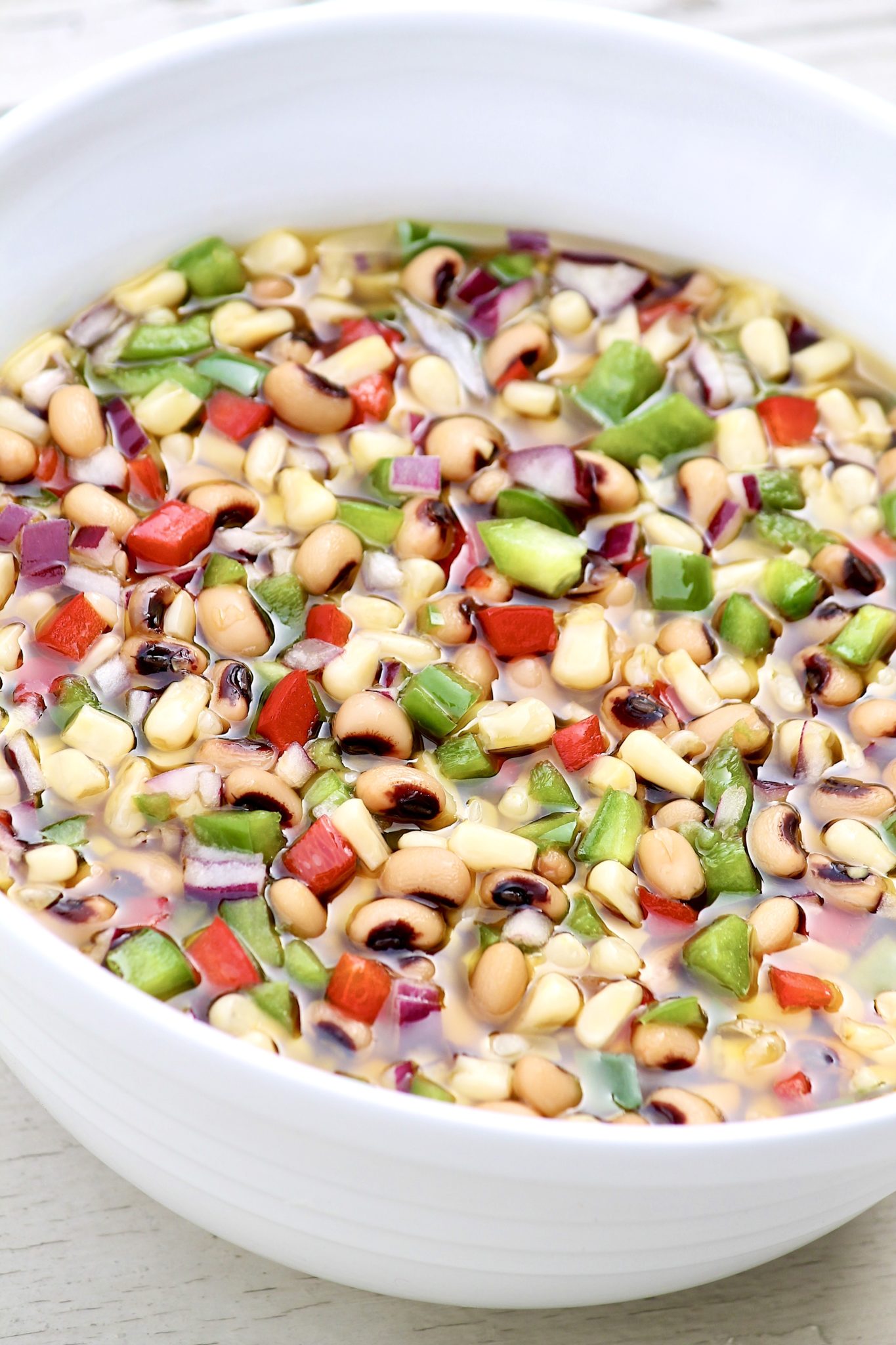 The unique preparation of this versatile recipe involves an easy, sweet-and-sour marinade that is drained off before serving. Serve as a dip with tortillas chips, a side salad, or as a salsa for chicken or fish. Perfect for a potluck and leftovers keep well for the better part of a week.