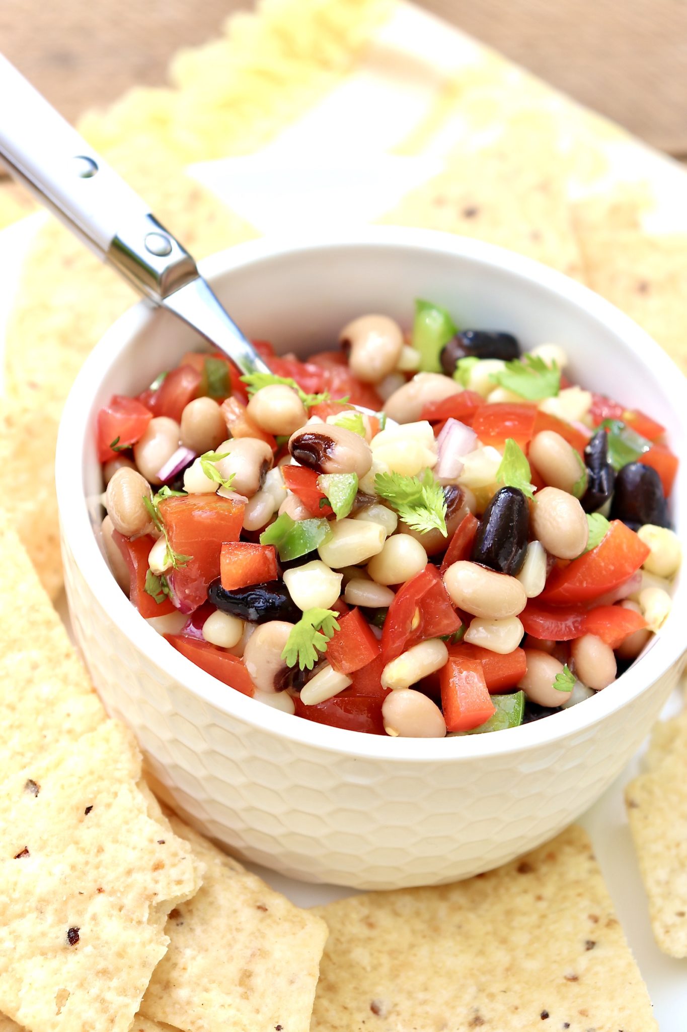 A make-ahead recipe with a cheeky name, this bean-based dip, commonly served with tortilla chips, is equally delicious as a salad or salsa. Perfect for family meals and casual entertaining, Cowboy Caviar is always a hit!