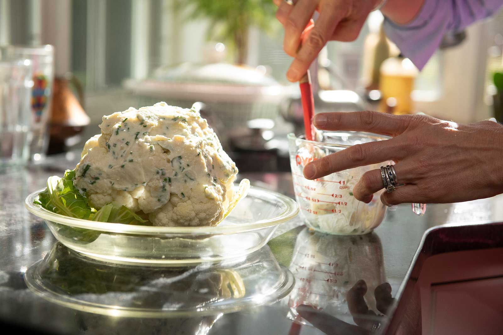 A whole roasted head of cauliflower is delicious AND impressive. It can also be easy and relatively quick thanks to a helpful shortcut!