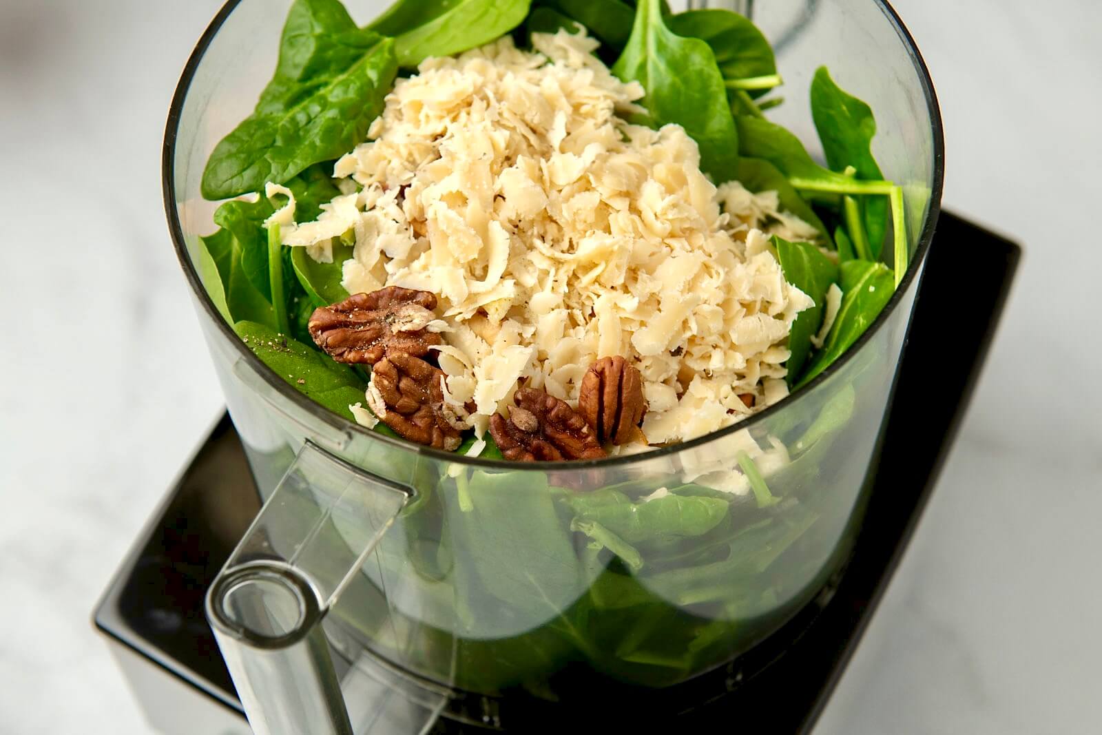 Easy, accessible, and endlessly versatile, this flavorful pesto is especially ideal when fresh herbs aren't available. Perfect for adding flavor to pasta, pizza and flatbread, sauces, sandwiches, and so much more, the simple recipe can be customized with a variety of nuts, seeds, and cheeses. Plus it maintains its vibrant green color and freezes well!