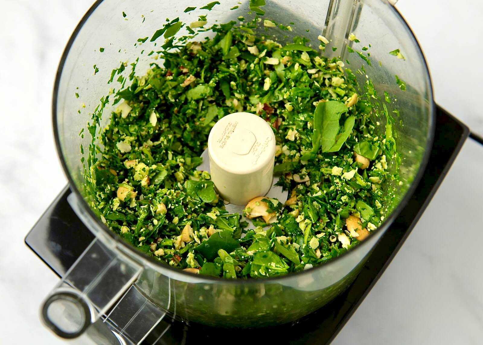 Easy, accessible, and endlessly versatile, this flavorful pesto is especially ideal when fresh herbs aren't available. Perfect for adding flavor to pasta, pizza and flatbread, sauces, sandwiches, and so much more, the simple recipe can be customized with a variety of nuts, seeds, and cheeses. Plus it maintains its vibrant green color and freezes well!