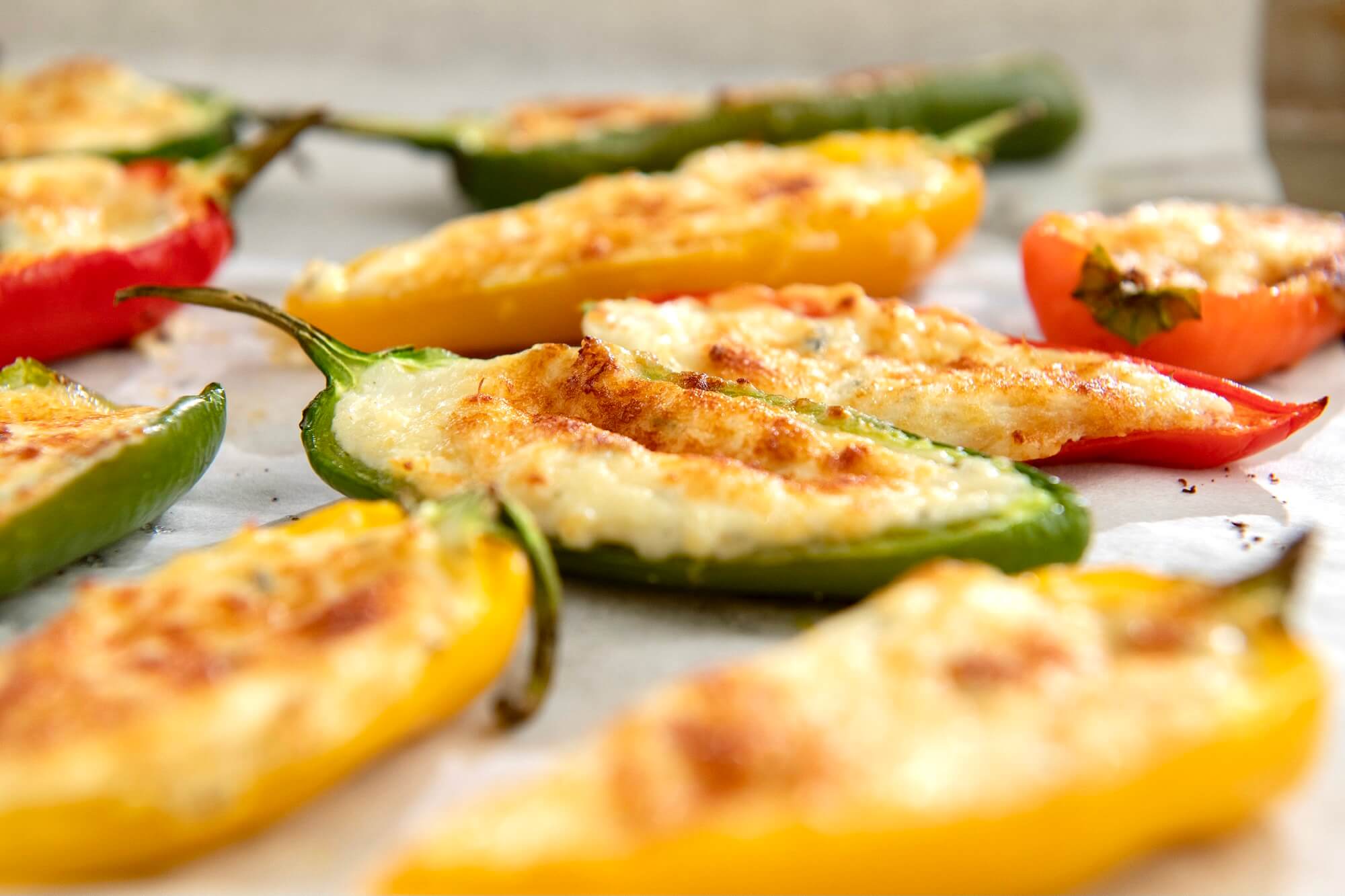 Easy Cheesy Mini Peppers are a delicious appetizer that are essentially a baked, less spicy version of a jalapeño popper...but you can make them as jalapeño poppers if you prefer!