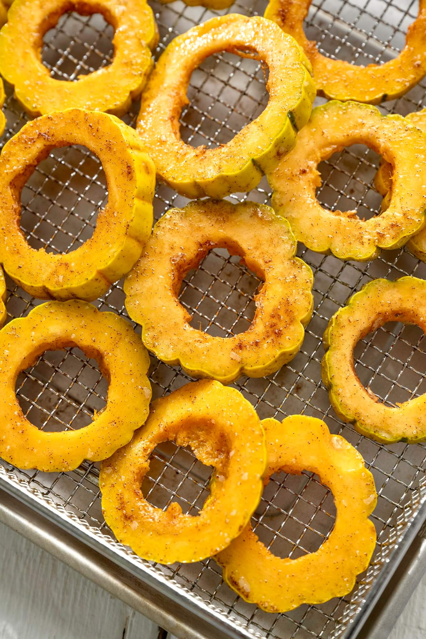 Warm spices add seasonal appeal to this easy side dish that quickly cooks to golden perfection in the oven or air fryer. Feel free to mix things up with a different variety of winter squash (or sweet potatoes) and a short list of optional toppings if inclined.