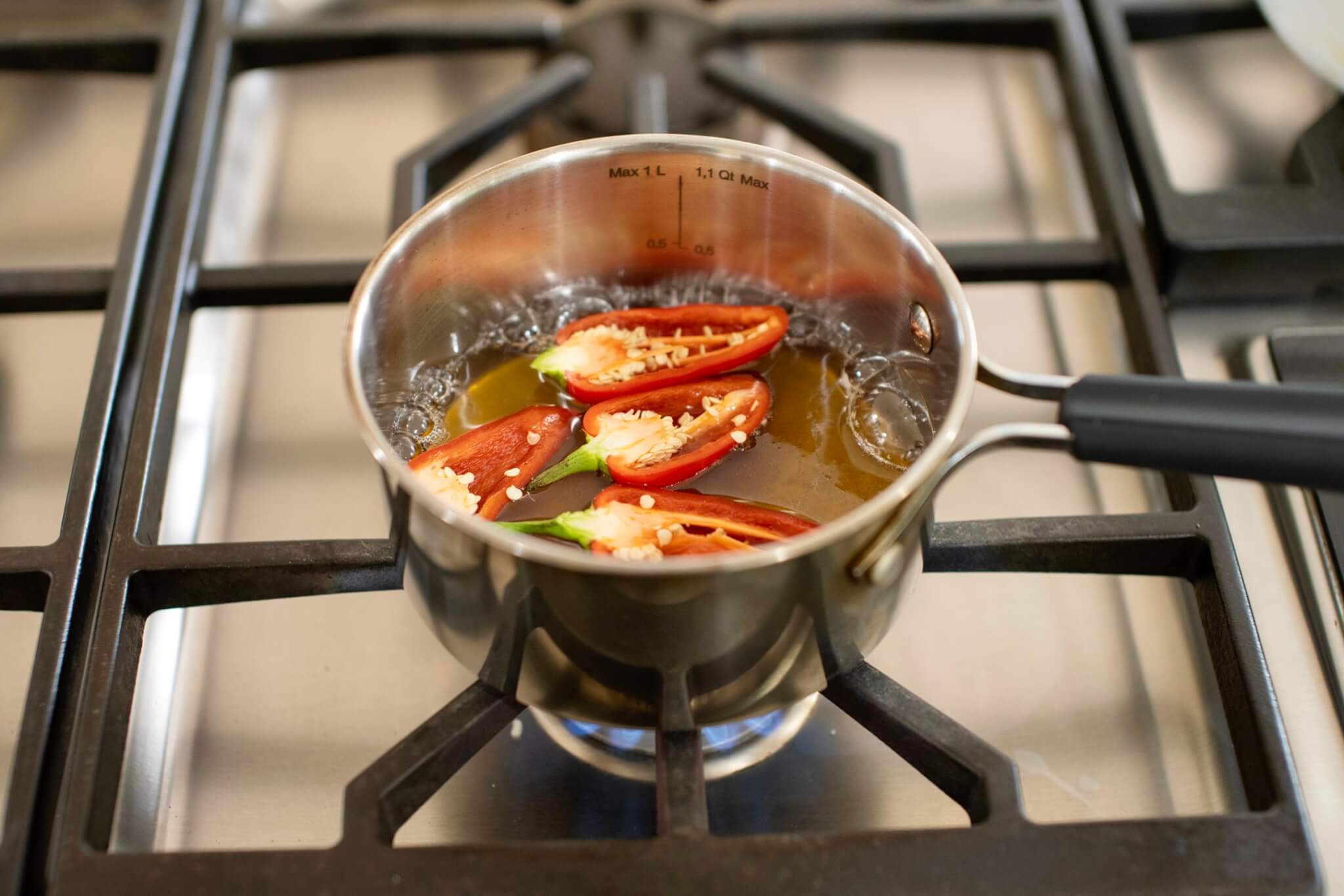 Add spicy-sweet appeal to all sorts of sweet and savory dishes with this buzz-worthy condiment that's easy to make at home and less expensive than store-bought. Makes a great gift, too!