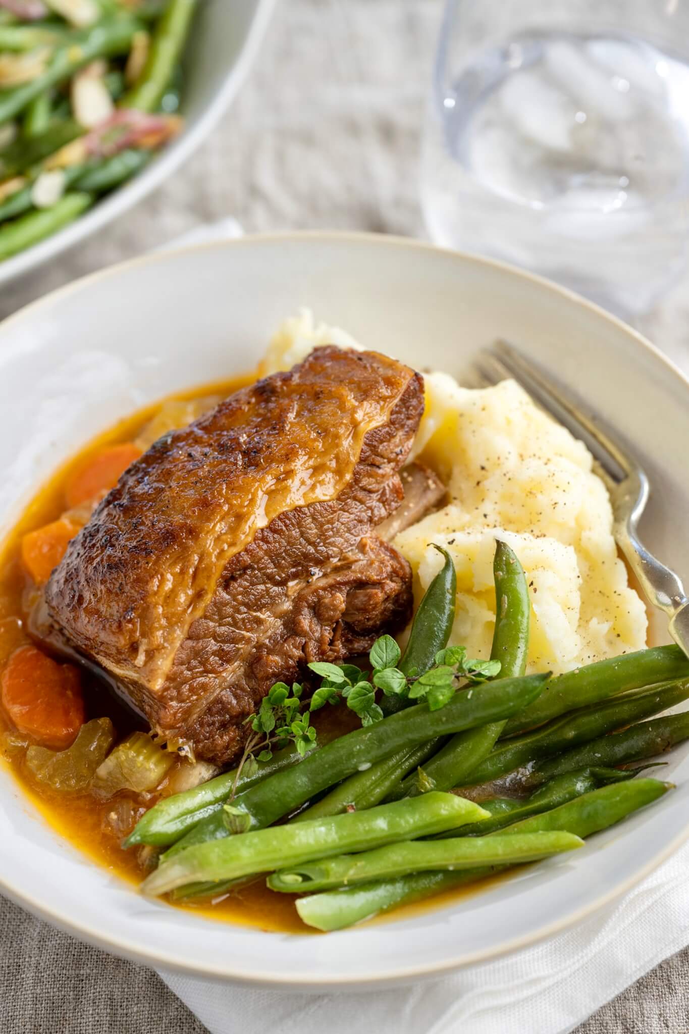Easy prep is followed by a low and slow stint in the oven for flavorful, fork tender meat that will warm your soul. Optional day-ahead prep offers added benefits and convenience.