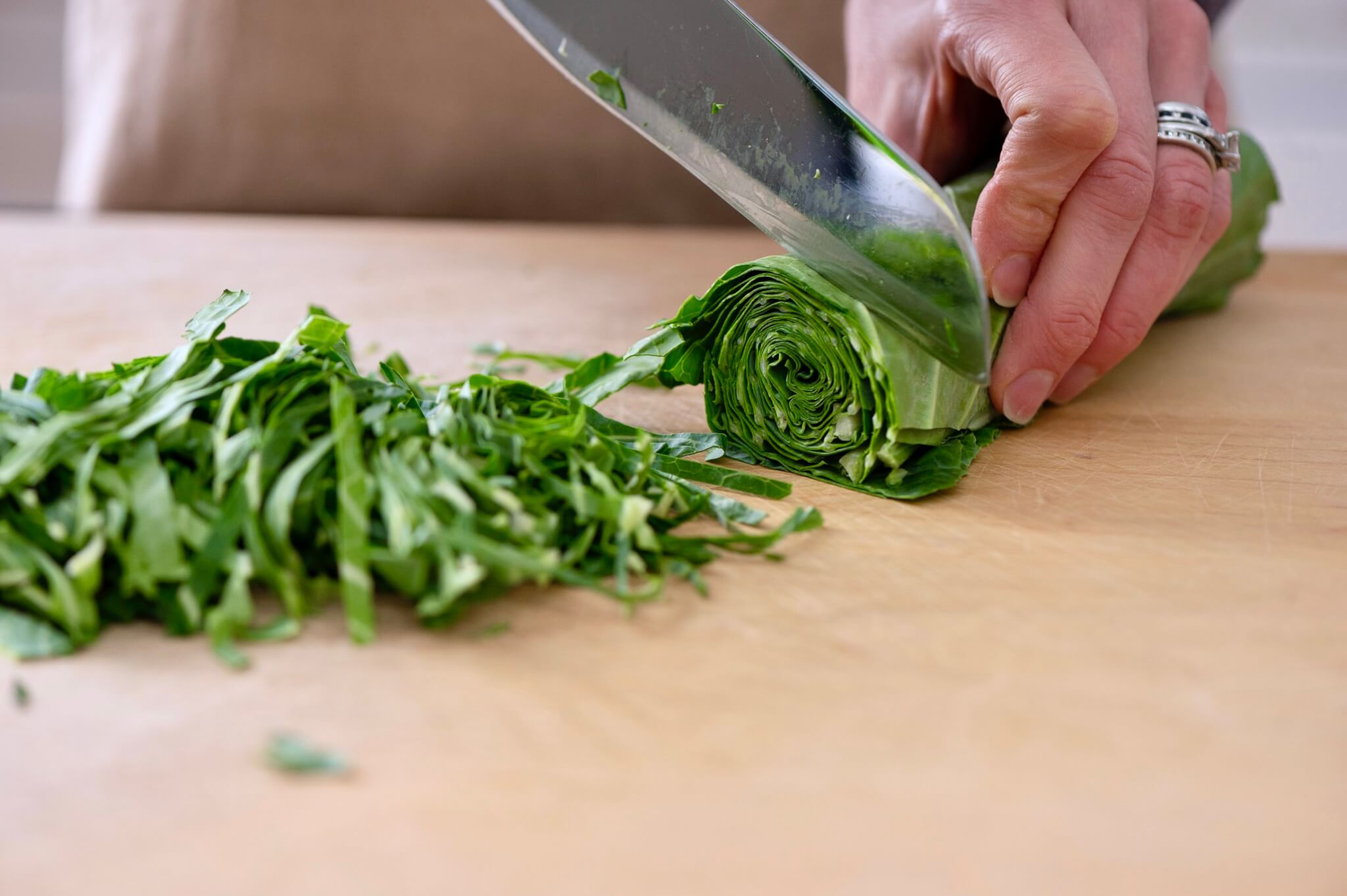 Easiest way to thinly slice collards for quick cooking.
