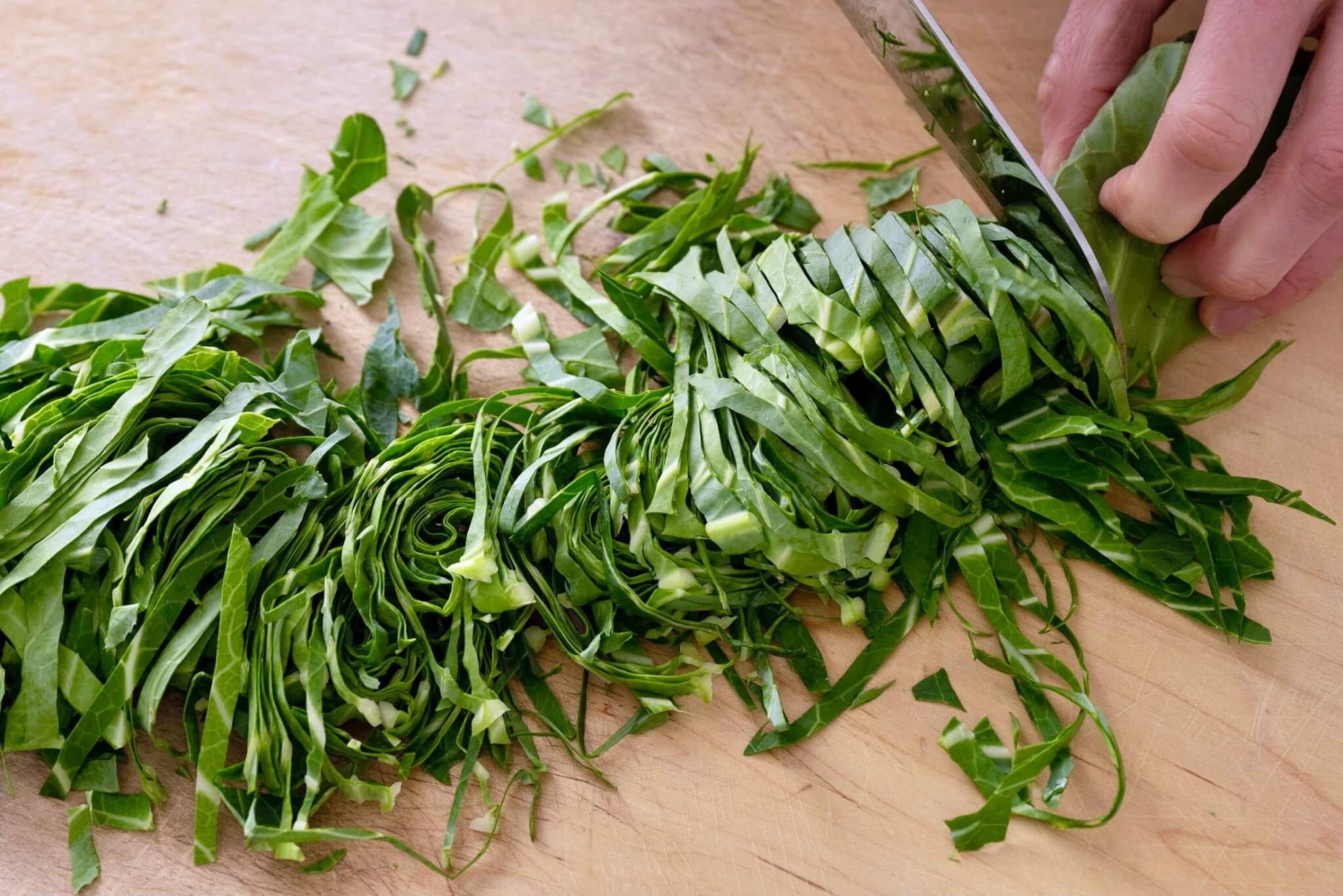 Easiest way to thinly slice collards for quick cooking.