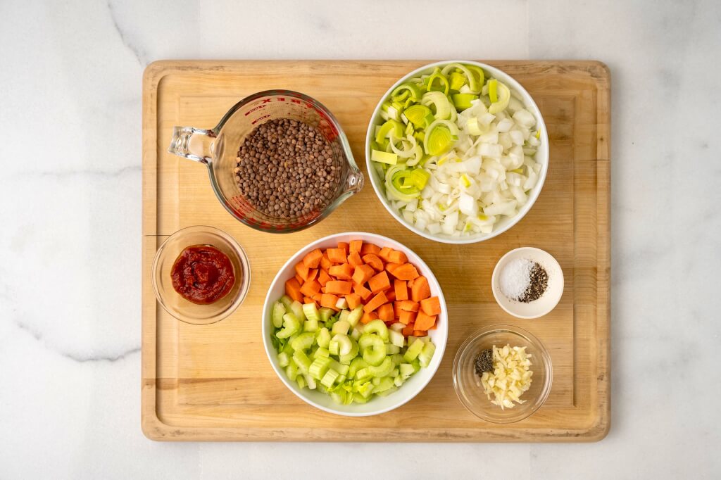Colorful vegetables and hearty lentils come together with ease in this one pot dish that serves as a filling vegetarian meal or can be used as a base for seared salmon or another protein of choice.