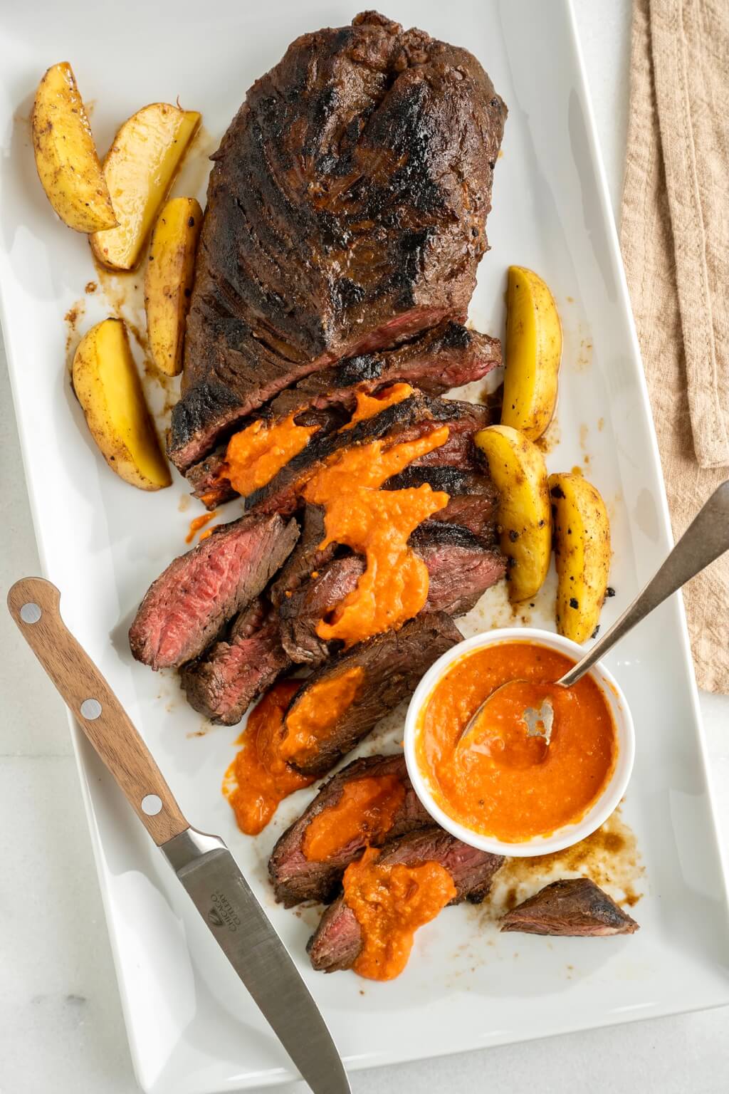 A simple but well constructed marinade produces a steak that is BURSTING with flavor, whether grilled or cooked on the stovetop. The vibrant sauce is optional but endlessly versatile.