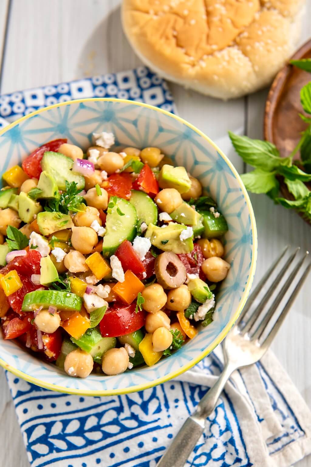 An economical can of beans mixes with fresh veggies and a flavorful vinaigrette in this versatile, plant-based salad that can be adapted in countless ways.