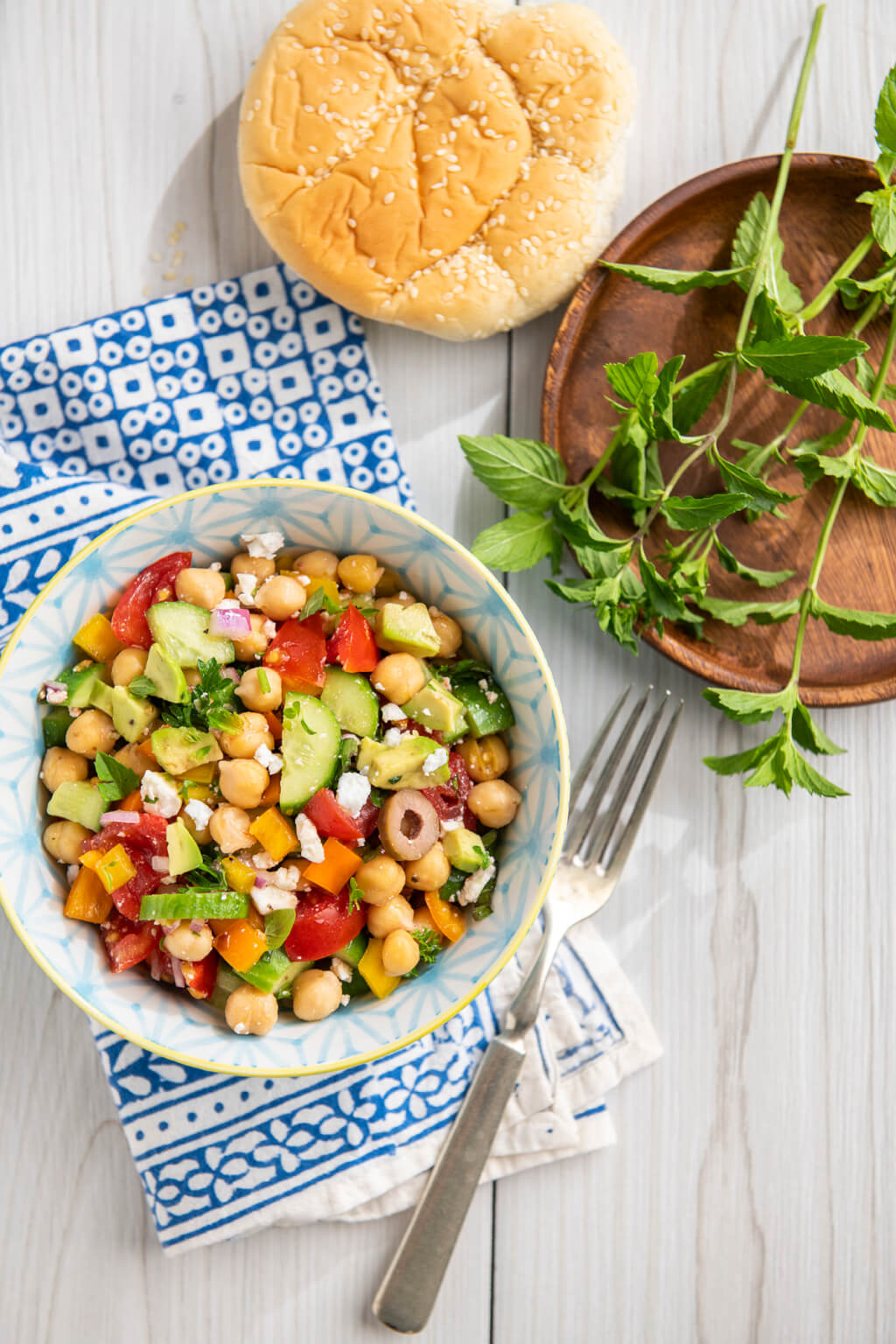 An economical can of beans mixes with fresh veggies and a flavorful vinaigrette in this versatile, plant-based salad that can be adapted in countless ways.