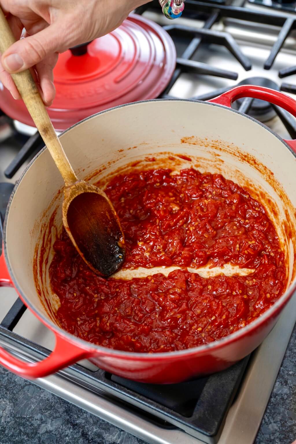 Easy-to-make tomato jam is savory and tangy with a hint of spicy sweetness. An ideal way to use a bumper crop of tomatoes, the rustic jam is a delightful alternative to ketchup on a burger or chutney on grilled chicken, fish, or pork.