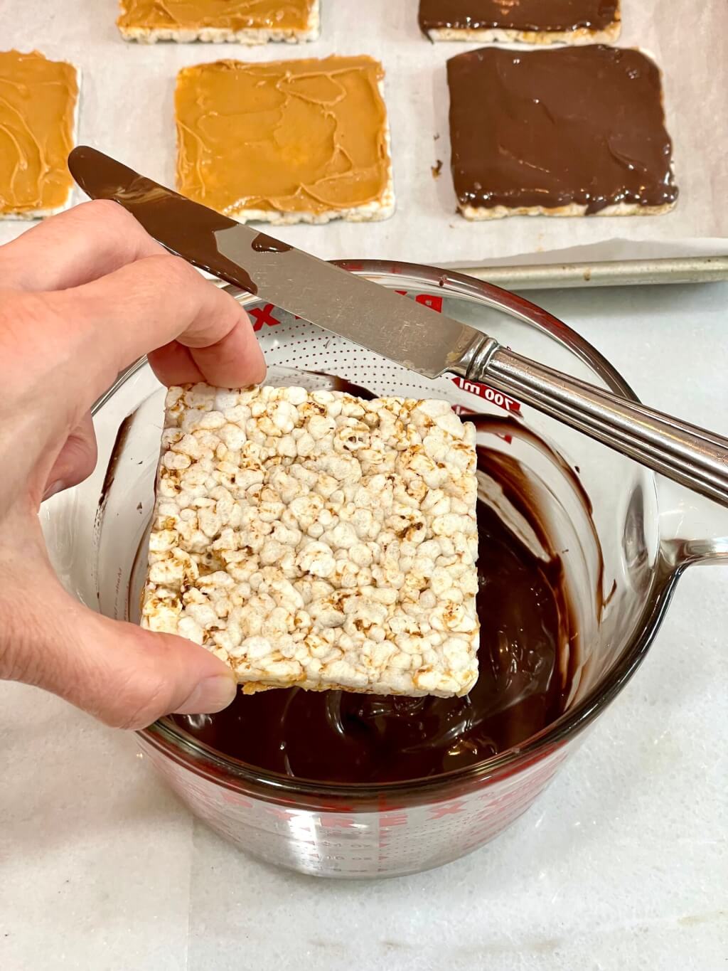 The viral recipe gets an easy upgrade for a better ratio of peanut butter and chocolate to rice cake. And with one tablespoon of peanut butter and just two teaspoons of chocolate per rice cake, it’s a mostly healthy snack too!